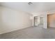 Neutrally decorated bedroom featuring a closet with mirrored doors and a sunny window at 7013 Pacific Coast St, Las Vegas, NV 89148
