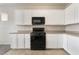 This well-lit kitchen offers ample cabinet space and modern black appliances at 7013 Pacific Coast St, Las Vegas, NV 89148
