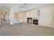 Comfortable living room featuring a cozy fireplace and neutral color palette at 7013 Pacific Coast St, Las Vegas, NV 89148