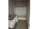 Bathroom featuring a dual sink vanity, toilet and bathtub with shower, in need of repair at 717 Madison Ave, Las Vegas, NV 89106