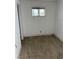 Bedroom featuring a window with barred security, in need of repair at 717 Madison Ave, Las Vegas, NV 89106
