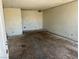 Empty living room with damaged floors, plain walls, and electrical outlets visible at 717 Madison Ave, Las Vegas, NV 89106