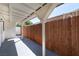 Covered back porch with wood fence and ceiling, perfect for outdoor relaxation at 724 N 9Th St, Las Vegas, NV 89101