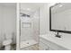 Modern bathroom features a walk-in shower with marble tiling and sleek black fixtures at 724 N 9Th St, Las Vegas, NV 89101