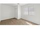 Neutral bedroom featuring new carpeting, white walls, and ample natural light at 724 N 9Th St, Las Vegas, NV 89101