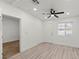 Bright bedroom with modern fan, neutral walls, wood-look floors, and natural light at 724 N 9Th St, Las Vegas, NV 89101