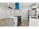 Bright, updated kitchen features stainless steel appliances and an island cooktop at 724 N 9Th St, Las Vegas, NV 89101