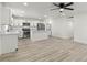 This bright kitchen offers stainless appliances, white cabinetry, an island, and in-unit washer/dryer hookups at 724 N 9Th St, Las Vegas, NV 89101