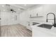 Open-concept kitchen with stainless steel appliances, modern cabinets, and a spacious layout at 724 N 9Th St, Las Vegas, NV 89101