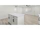 Kitchen features white cabinets, quartz countertops, stainless appliances, and island, providing ample space and modern amenities at 724 N 9Th St, Las Vegas, NV 89101