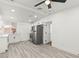 Bright kitchen with stainless steel appliances, white cabinetry, and modern light fixtures at 724 N 9Th St, Las Vegas, NV 89101