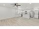 This bright kitchen offers stainless appliances, white cabinetry, an island, and in-unit washer/dryer hookups at 724 N 9Th St, Las Vegas, NV 89101