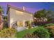 Beautiful backyard featuring a patio area with comfortable seating and lush green artificial grass at 7505 Mission Palm St, Las Vegas, NV 89139