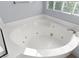 Oversized soaking tub has jets and a privacy glass window at 7505 Mission Palm St, Las Vegas, NV 89139