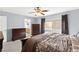 Cozy bedroom shows neutral paint, nice window and adjoining bath at 7505 Mission Palm St, Las Vegas, NV 89139