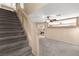 Entryway featuring carpeted stairs and a view of the dining area through a cut out at 7505 Mission Palm St, Las Vegas, NV 89139