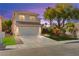 Charming two-story home featuring a two-car garage and well-manicured front yard landscaping at 7505 Mission Palm St, Las Vegas, NV 89139