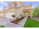 Inviting home with a two-car garage, beautiful landscaping and a well-maintained lawn at 7505 Mission Palm St, Las Vegas, NV 89139