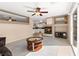Bright living room connects to kitchen, featuring a fireplace and sliding glass doors at 7505 Mission Palm St, Las Vegas, NV 89139