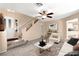 Staged living room with neutral tones, plush carpeting, and an elegant marble coffee table at 7505 Mission Palm St, Las Vegas, NV 89139