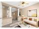Staged loft area featuring decorative columns, ceiling fan, and a sofa at 7505 Mission Palm St, Las Vegas, NV 89139
