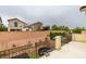 A backyard view with a patio, fence, and landscaping, offering a serene outdoor living space at 7553 Old Compton St, Las Vegas, NV 89166