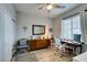 Office bedroom area, featuring hardwood floors, a desk, and neutral colors at 7553 Old Compton St, Las Vegas, NV 89166