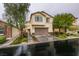 Charming two-story home with a well-maintained lawn, beautiful landscaping, and an attached two-car garage at 7553 Old Compton St, Las Vegas, NV 89166