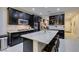 Spacious kitchen with granite countertops, stainless steel appliances, an island, and seating at 7553 Old Compton St, Las Vegas, NV 89166