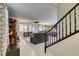 Bright and open living room with tile floors, large windows, and a staircase leading to the upper level at 7553 Old Compton St, Las Vegas, NV 89166