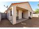 Charming home featuring a covered back patio and a spacious gravel backyard, ideal for outdoor enjoyment at 7628 Picnic St, Las Vegas, NV 89131