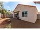 Spacious gravel backyard, enclosed by a block wall fence, offering privacy and space for outdoor activities at 7628 Picnic St, Las Vegas, NV 89131