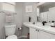 Well-lit bathroom featuring a white vanity with modern fixtures and a neutral color scheme at 7628 Picnic St, Las Vegas, NV 89131