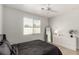 Bright bedroom featuring wood floors, white trim and plenty of natural light at 7628 Picnic St, Las Vegas, NV 89131
