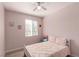 Cozy bedroom with natural light and soft pink walls at 7628 Picnic St, Las Vegas, NV 89131