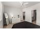 Bedroom featuring wood floors, white trim, adjacent bathroom, and walk in closet at 7628 Picnic St, Las Vegas, NV 89131
