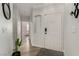 Bright entryway with wood floors, neutral walls, and modern decor accents at 7628 Picnic St, Las Vegas, NV 89131