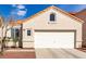 Inviting single-story home featuring a two-car garage and desert landscaping at 7628 Picnic St, Las Vegas, NV 89131