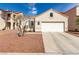 Well-maintained single-story home with a two-car garage and easy-care landscaping at 7628 Picnic St, Las Vegas, NV 89131