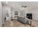 Modern living room with wood floors, a neutral color palette, and ample natural light at 7628 Picnic St, Las Vegas, NV 89131