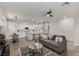 Inviting living area with a cozy sofa, wood floors, and an open floor plan at 7628 Picnic St, Las Vegas, NV 89131