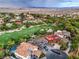 Breathtaking aerial view of luxury homes near a golf course, highlighting tile roofs and lush landscaping at 8 Rue Du Ville Way, Henderson, NV 89011