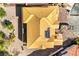 An aerial view of an unfinished home showcasing the roof, surrounding landscape and construction materials at 8 Rue Du Ville Way, Henderson, NV 89011