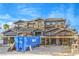 New construction featuring a multi-story home with scaffolding and exterior finishes, set against a blue sky at 8 Rue Du Ville Way, Henderson, NV 89011