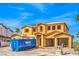 An unfinished two-story house featuring a wooden frame and a dumpster for construction materials at 8 Rue Du Ville Way, Henderson, NV 89011