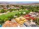New home under construction with a beautiful view of the golf course in a desert community with mature landscaping at 8 Rue Du Ville Way, Henderson, NV 89011