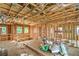 View of interior framing with wood studs, ceiling joists, and windows providing natural light at 8 Rue Du Ville Way, Henderson, NV 89011
