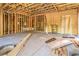 Spacious room showcasing exposed wood framing and concrete flooring, perfect for customization and finishing touches at 8 Rue Du Ville Way, Henderson, NV 89011