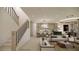 Inviting living room with modern lighting, open-concept design, adjacent to a stylish kitchen with an island and a dining area at 8 Rue Du Ville Way, Henderson, NV 89011