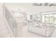 Open-concept living space, seamlessly connecting the kitchen, living, and dining areas, filled with natural light at 8 Rue Du Ville Way, Henderson, NV 89011